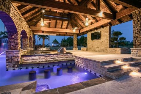 Fantastic Multi Use Pool Area With Swim Up Bar Built In Grill And Seating Area Backyard