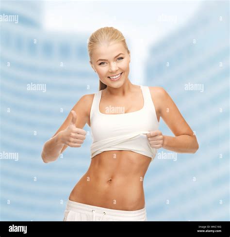 Sporty Woman Showing Thumbs Up Stock Photo Alamy