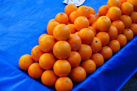 Group Of Fresh Organic Oranges On The Market Stall Oranges On The