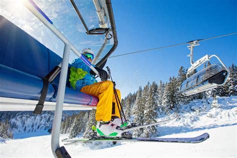Skier Sitting At Ski Chair Lift Stock Image Image Of Sitting Male