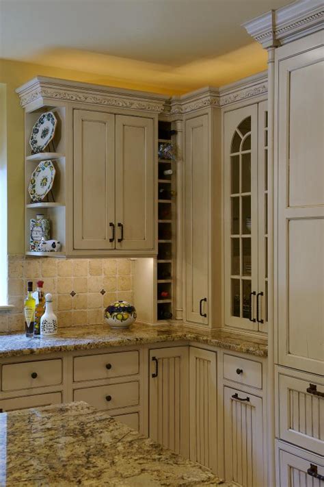 Consider painting your kitchen cabinets cream if you're working with a small kitchen; Gorgeous Cream Cabinets in Traditional Kitchen | HGTV