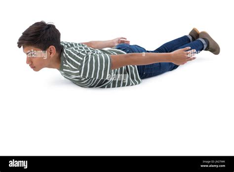 Teenage Boy Lying On The Floor Against White Background Stock Photo Alamy