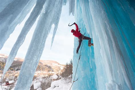 Strong Woman Ice Climbing On Frozen Waterfall By Stocksy Contributor