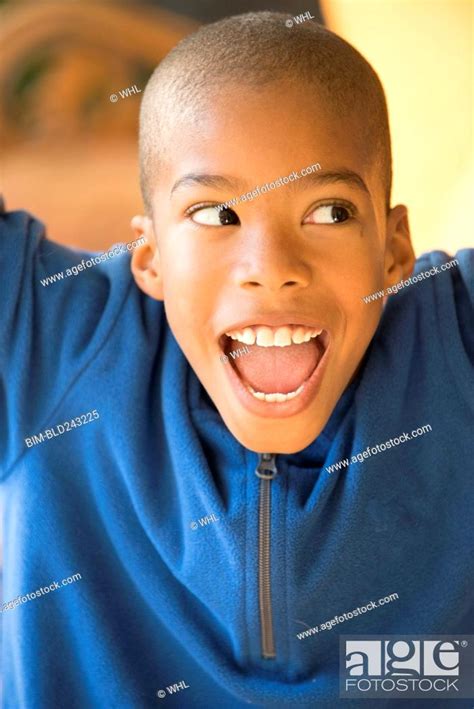 Close Up Of Smiling Mixed Race Boy Stock Photo Picture And Royalty