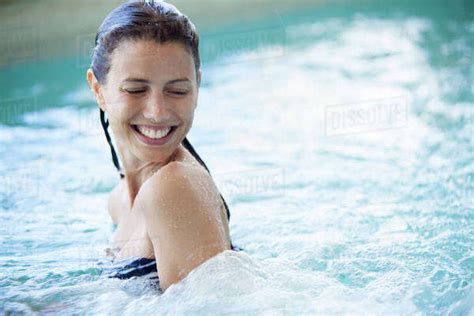 Woman Swimming In Pool Stock Photo Dissolve