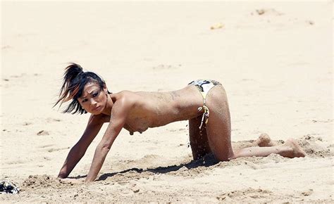 Actress Bai Ling Flashes Her Nipples On The Beach In