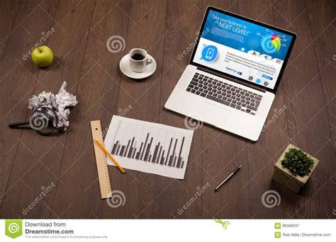 Laptop On Office Desk With Business Website On Screen Stock Image