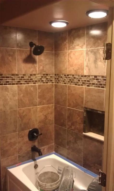 Two, it removes the tubs so it's friendly for those of us who have a hard time climbing over that edge! tile bathroom designs 2017 - Grasscloth Wallpaper