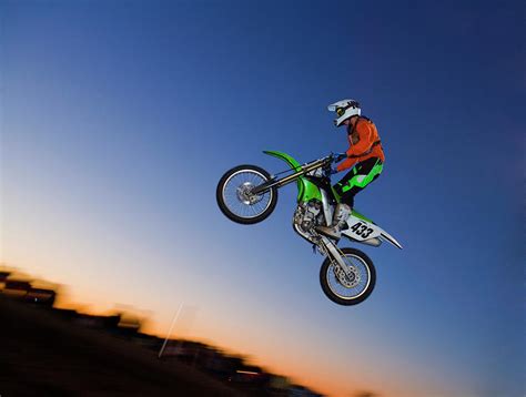 Motorcross Rider Jumping Dirt Bike Photograph By Jupiterimages Fine
