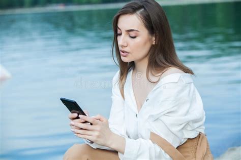 Girl Outdoors Texting On Her Mobile Phone Girl With Phone Portrait Of