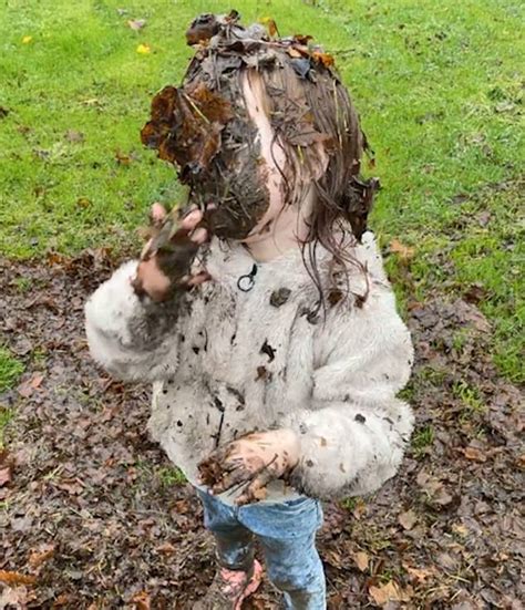 Mud Pack Moment Five Year Old Girl Covers Her Face With Leaves And