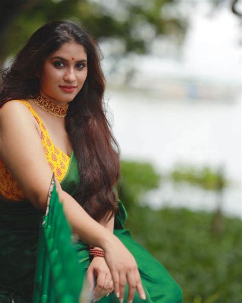 beautiful and sexy stills radhika radhakrishnan in sleeveless blouse and saree hot photos