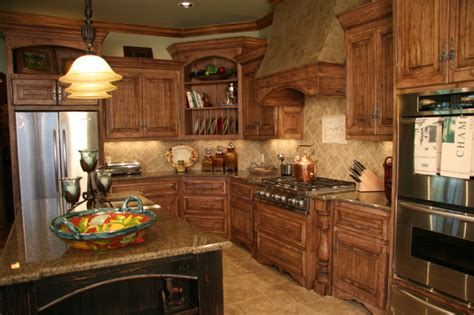 Embrace the flaws and knots in the wood and the different shades. Old World Charm - Traditional - Kitchen - Oklahoma City - by Monticello Cabinets & Doors