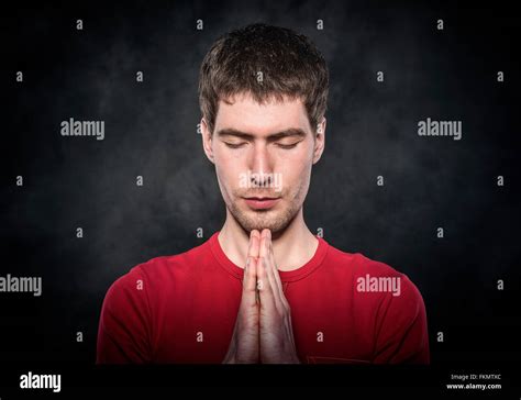 Man Praying With Hands Clasped Stock Photo Alamy
