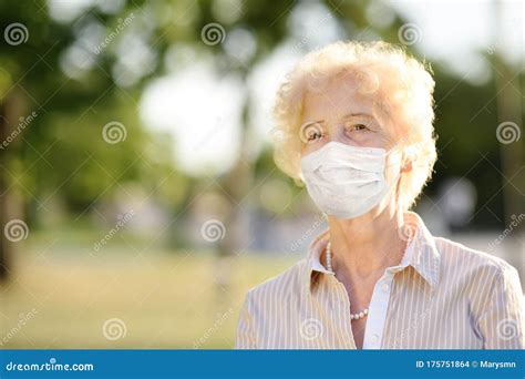 Outdoors Portrait Senior Woman Wearing Disposable Medical Face Mask