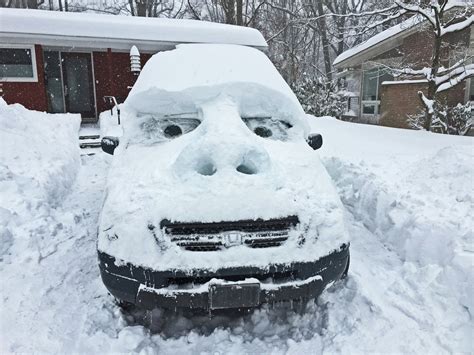 Sculpted Snow Face On Car Brings Smiles To Those Slammed By Blizzard
