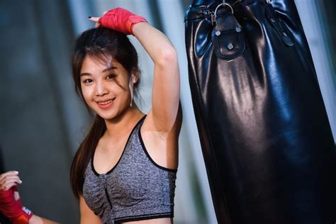 Premium Photo Sexy Asia Girl Punching Boxing Bag