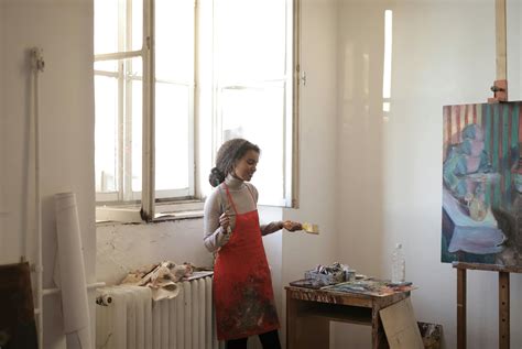 Female artist standing in studio · Free Stock Photo