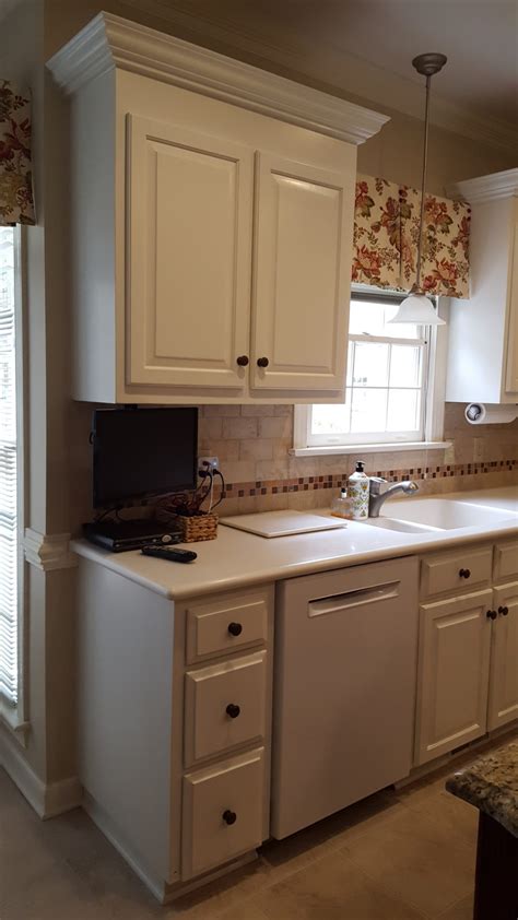 Add orange to the living room. Color Match - Oak Kitchen & Laundry cabinets - 2 Cabinet Girls