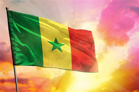 Fluttering Senegal Flag On Colorful Cloudy Sky Background Prosperity