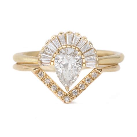10% iridium 90% platinum pear shape cut diamond with a baguette cut diamond ring 6.6 grams ring size 8 1 pear shape cut diamond 6.65 carats color. Pear Diamond Engagement Ring Set with Baguette Diamond Crown and Chevr - ARTEMER