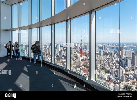 Visitors Looking Out Over The City From The Observation Deck Of The