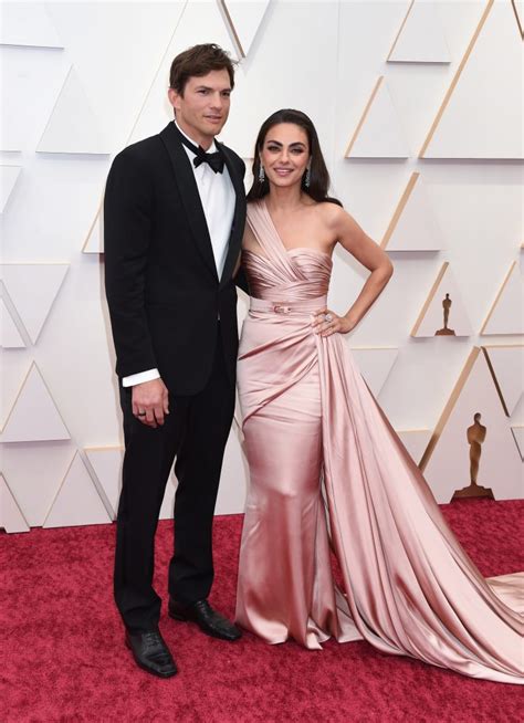 Mila Kunis Wows At Oscars In Romantic Pink Dress With Ashton Kutcher