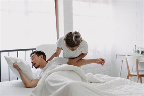 Funny Lovely Couple Wife Trying To Wake Husband Up In The Morning