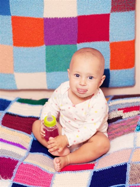 Baby Girl Holding A Bottle Stock Image Image Of Person 26477407