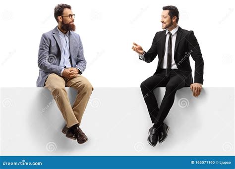 Two Men Sitting On A Panel And Having A Conversation Stock Photo Image Of Male Listening