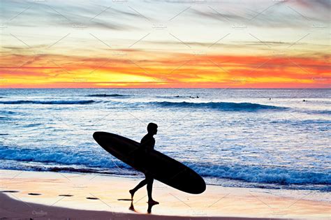 Longboard Surfer At Sunset Sports Stock Photos Creative Market
