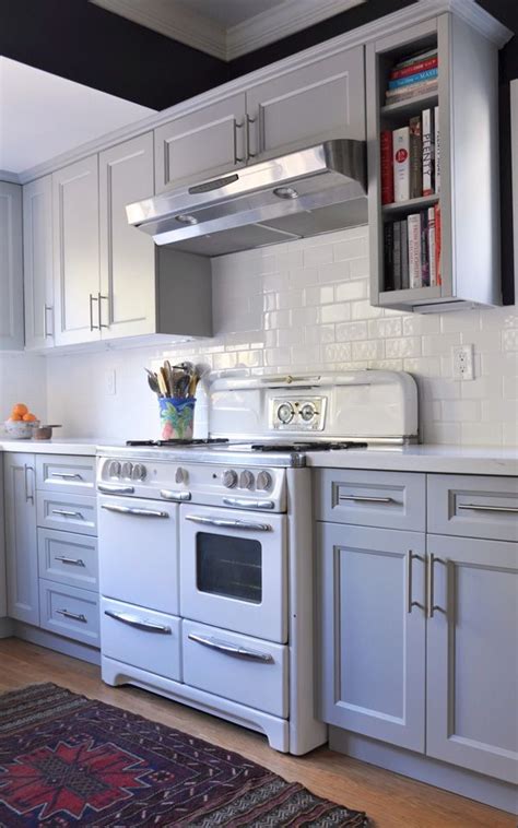 First, the quantity of flooring needed will decrease by the area under the cabinets. Kitchen Renovation, gray cabinets, hardwood floors, subway ...