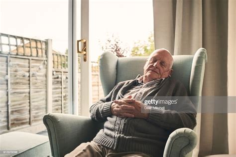 Relaxed Elderly Man Sleeping On A Armchair At Home High Res Stock Photo