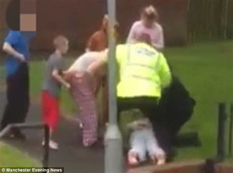 Shocking Moment Police Officer Pushes Woman To The Ground During Arrest Daily Mail Online