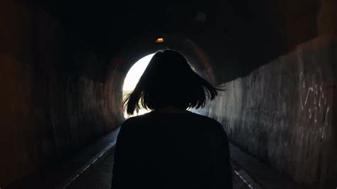 Woman Walking Through Tunnel Stock Video Motion Array