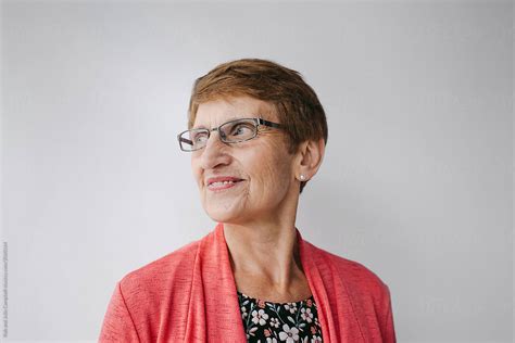 smiling woman wearing glasses by stocksy contributor rob and julia campbell stocksy