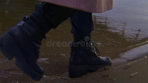 Close Up Of Woman Walking On Water In Shoes Stock Footage Stock Image