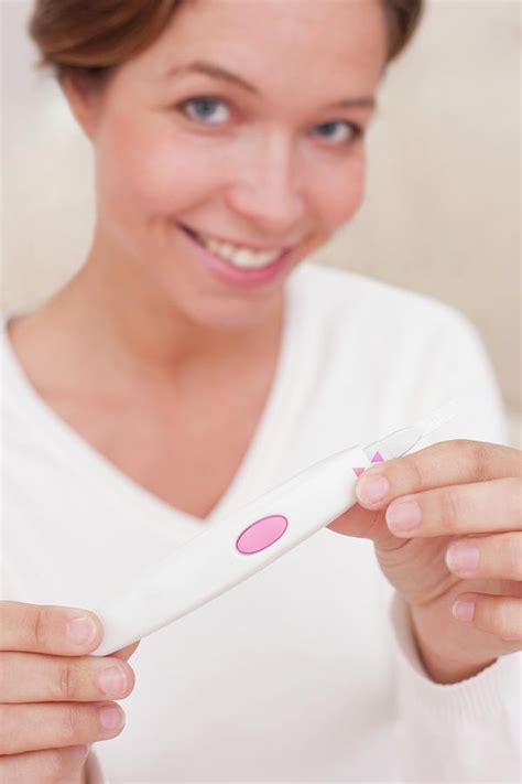 Woman Holding Positive Pregnancy Test Photograph By Science Photo