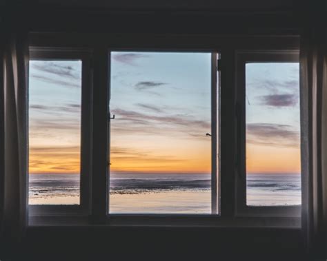 Free Photo Three Paneled Window With A Beautiful View Of The Sunset