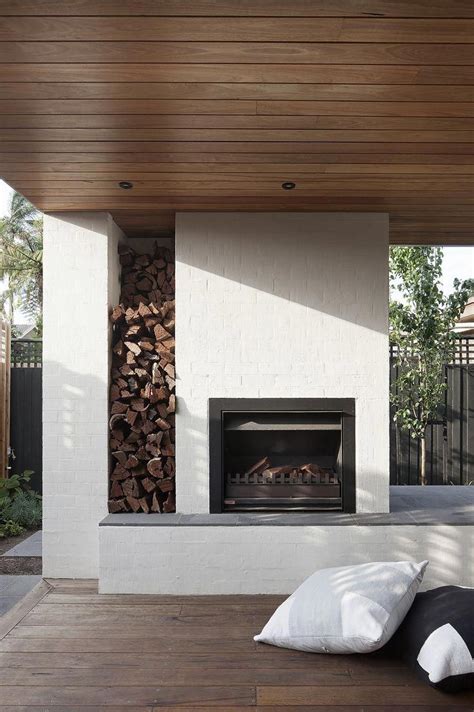An Outdoor Fireplace With Built In Firewood Storage When Stephen