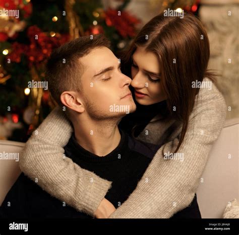 Young Romantic Cute Couple Staing At Home And Enjoying Time Together Lovers Hugging In Cristmas