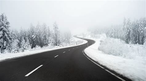 Road Between Snow Covered Forest Hd Winter Wallpapers Hd Wallpapers Id