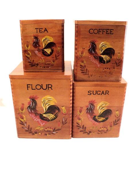 The front has little black plastic buttons that protrude that list what each canister. Wood Canister set Flour Sugar Coffee and Tea by ...