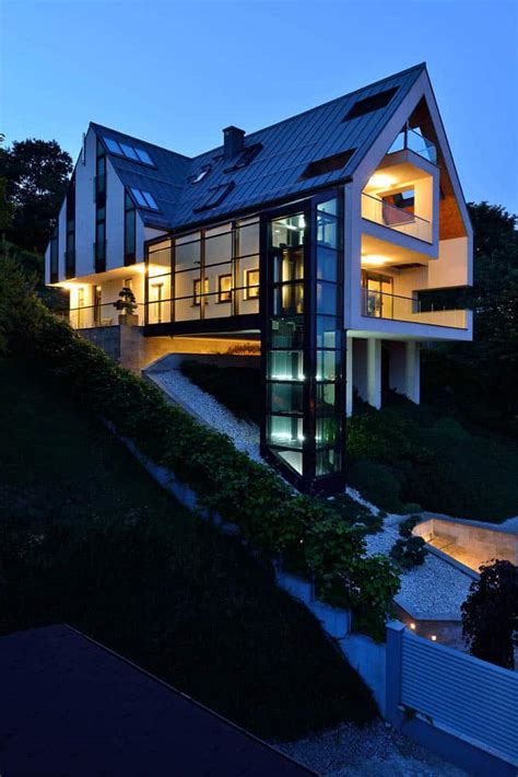 This idea from frank lloyd wright continues to guide many architects challenged by a home under construction on a steep terrain. Gorgeous Glass Elevator connects Multiple Levels on Slope ...