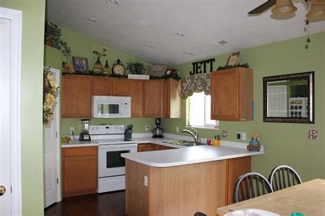 Dark flooring in a matt finish can add a rich texture, and handleless cabinets in off. The Jett Family: Kitchen Re-Do