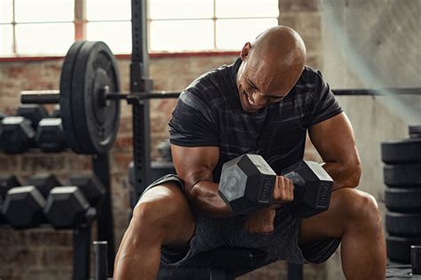 Strong Man Lifting Weight At Gym Stock Photo Download Image Now Istock