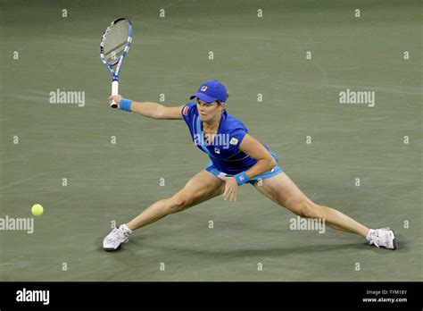 Kim Clijsters Of Belgium Stretches For A Ball In The First Set Against