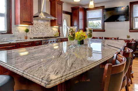 After all, granite is a natural stone with many different varieties, styles and textures to meet nearly every aesthetic need. Viscont White granite countertops with Cherry cabinets ...