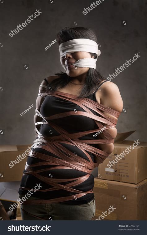 Стоковая фотография 53997199 Young Woman Tiedup Blind Folded Muted