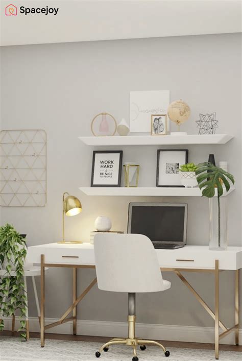 A White Desk With A Laptop Computer On Top Of It Next To A Potted Plant